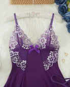 Purple lace babydoll close-up with white lace trim and bow at neckline