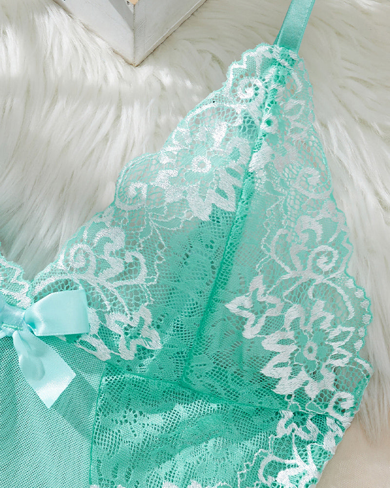Mint green lace babydoll slip side view with lace overlay and ribbon bow at neckline