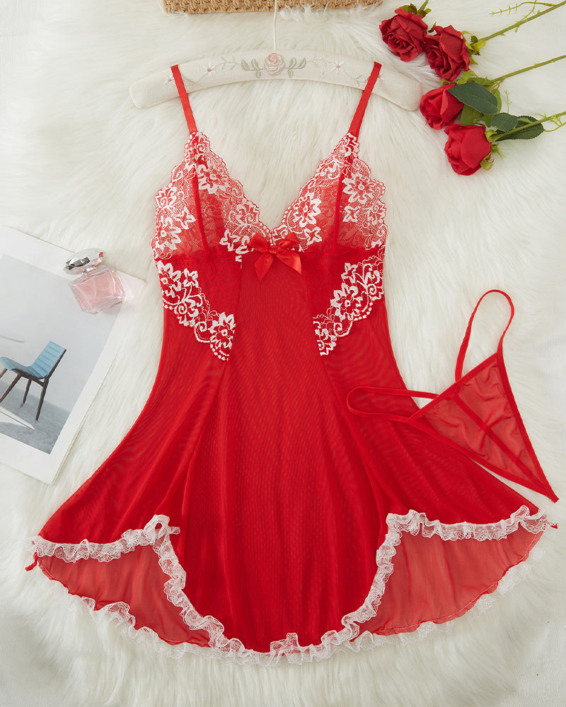 Red lace babydoll slip with V-neck, white lace appliques, and ruffled asymmetric hem