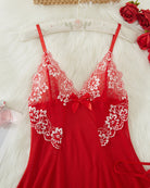 Red lace babydoll slip front with V-neck, white lace trim, and center ribbon bow