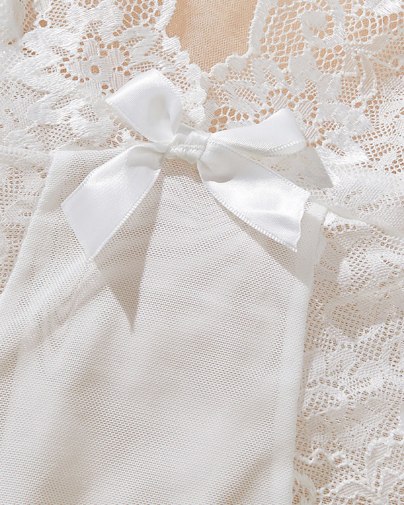 White lace babydoll with asymmetrical hem, bow-tie neckline detail