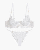 Embroidered lace bra and panty set, white, flat lay with underwire cups and lace thong