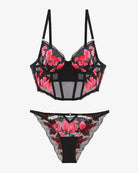Embroidered corset bra and panty set with black base and pink floral embroidery, two-piece