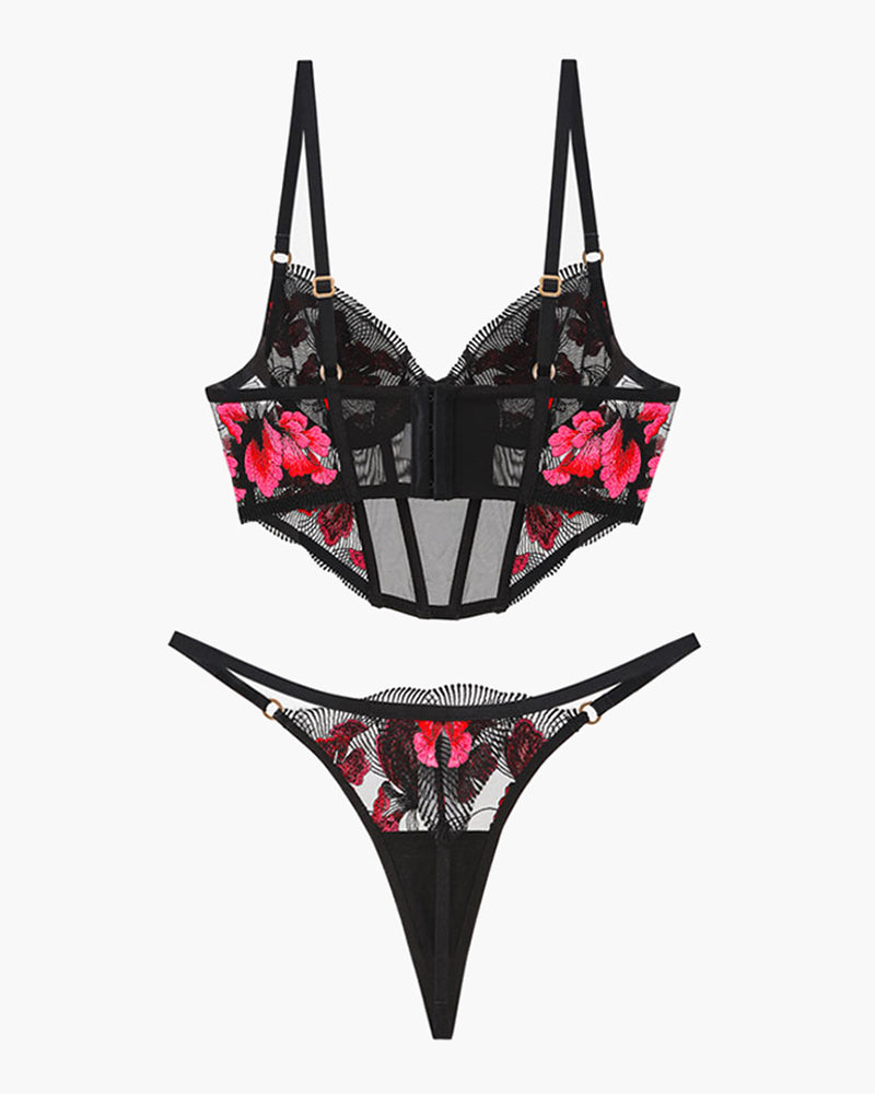 Black floral embroidered corset bra with sheer panels and matching thong set