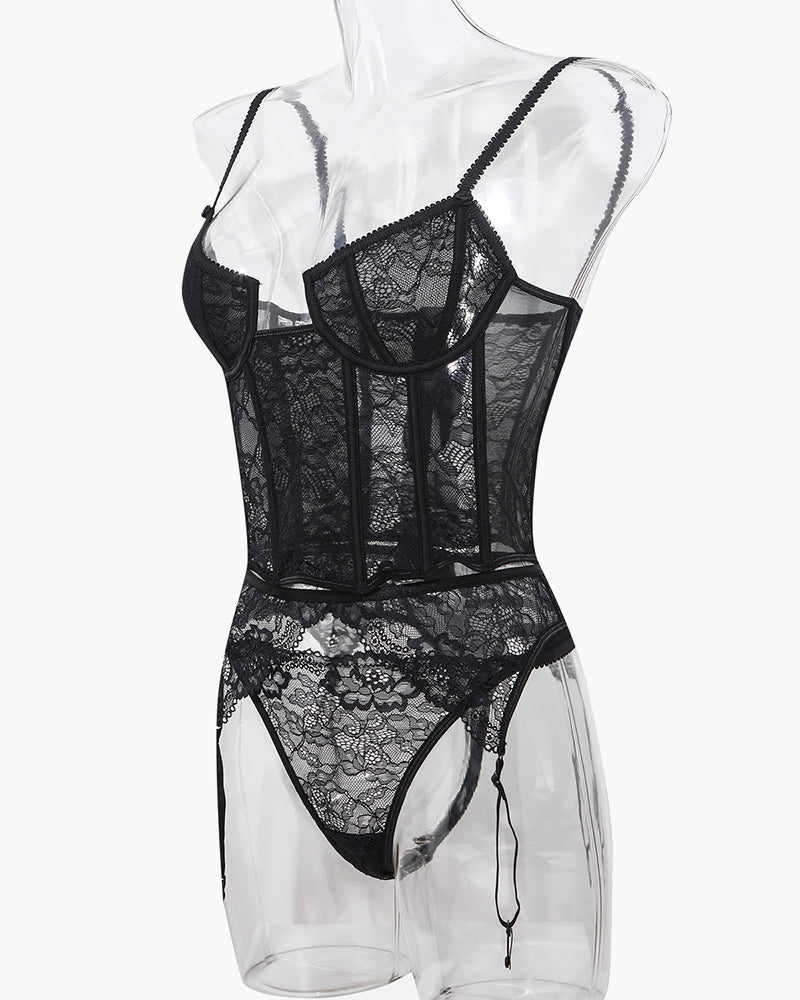 Black lace corset bra and panty set with push-up cups and hanging garter straps, angled