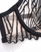 Black embroidered bra cup detail with striped mesh and scalloped edge trim
