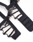 Black embroidered bra with adjustable straps and hook-and-eye closure