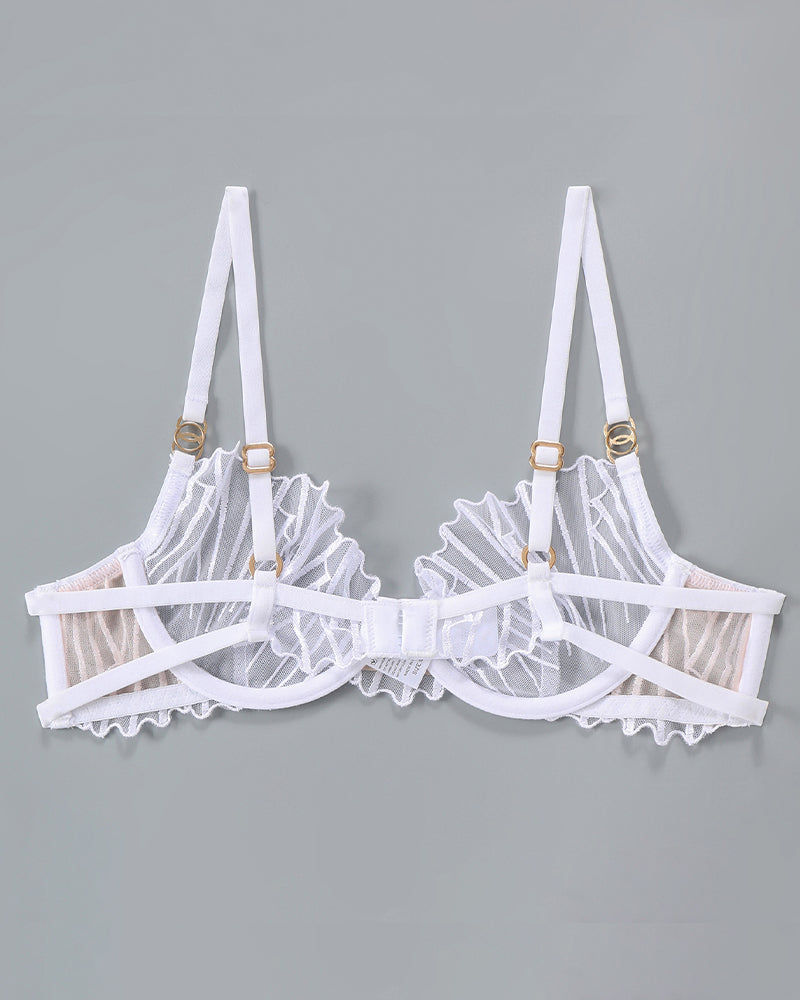 White thin embroidered bra with underwire cups, cross straps, and ruffled trim