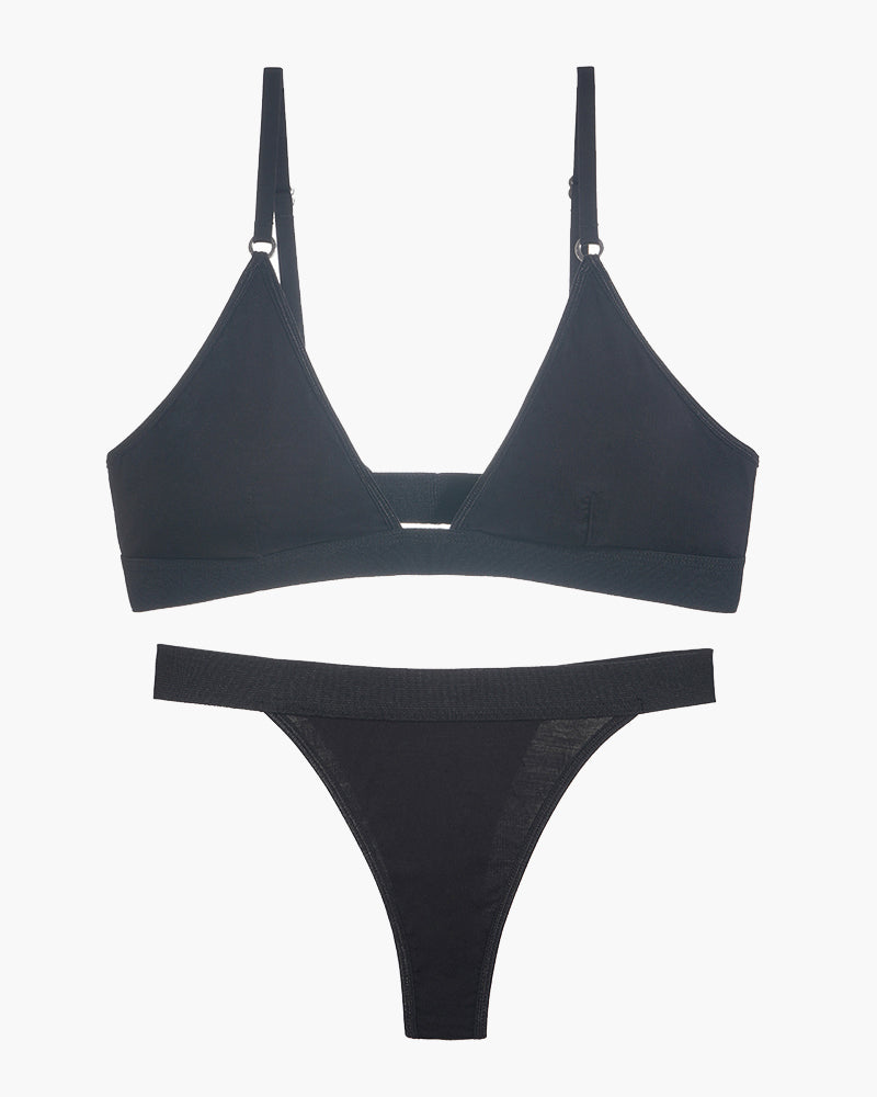 Black triangle bra and thong set laid flat, showing bra cups and thong brief