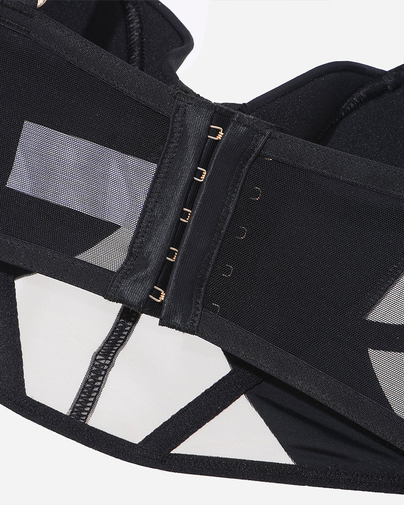 Black bra band detail with gold-toned hook-and-eye closure
