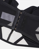 Black bra band detail with gold-toned hook-and-eye closure
