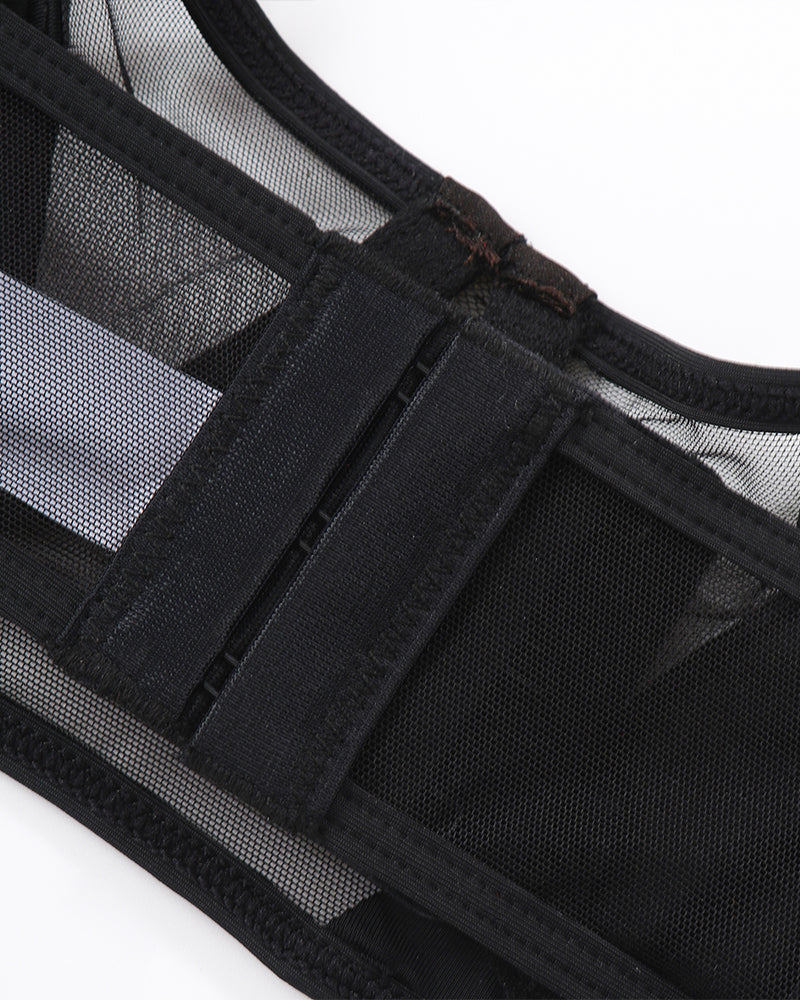 Black thong with sheer mesh paneling and elastic strap trim