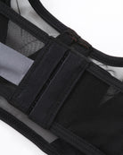 Black thong with sheer mesh paneling and elastic strap trim
