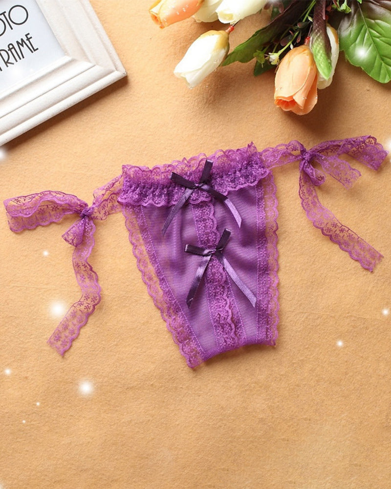 Purple lace crotchless thong with lace-up ribbon ties and front bow.