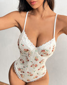 Floral lace bodysuit with underwire cups, thin spaghetti straps, lace-trim edges.