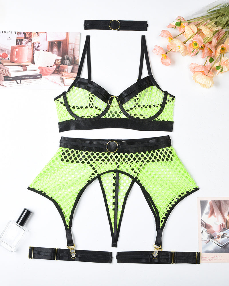 Neon green fishnet bra, panty and garter belt set with black bands, flat lay