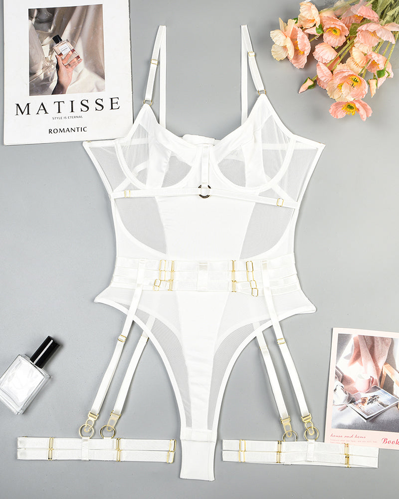 White lingerie bodysuit set with garter straps laid flat with matching harness pieces