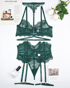 Green lace bra and panty set with garter belt, pieces laid out flat