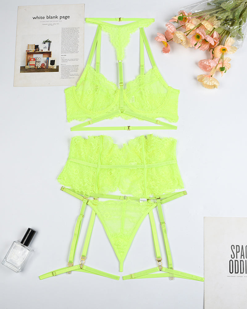 Neon green lace bra, panty, and garter belt set laid flat with matching hardware