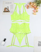 Neon green lace bra, panty, and garter belt set laid flat with matching hardware