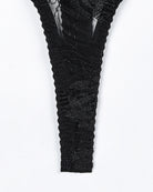 Black lace thigh garter stocking with textured floral pattern and sheer sections