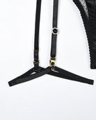Black lace lingerie bra straps with adjustable rings and gem detail