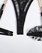 Black lace thong with gold-tone chain straps and lace trim