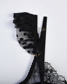 Black mesh and lace lingerie strap with floral pattern and gold-tone buckle