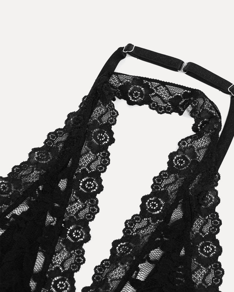Black lace halter crop top with scalloped trim and circular motif neckline