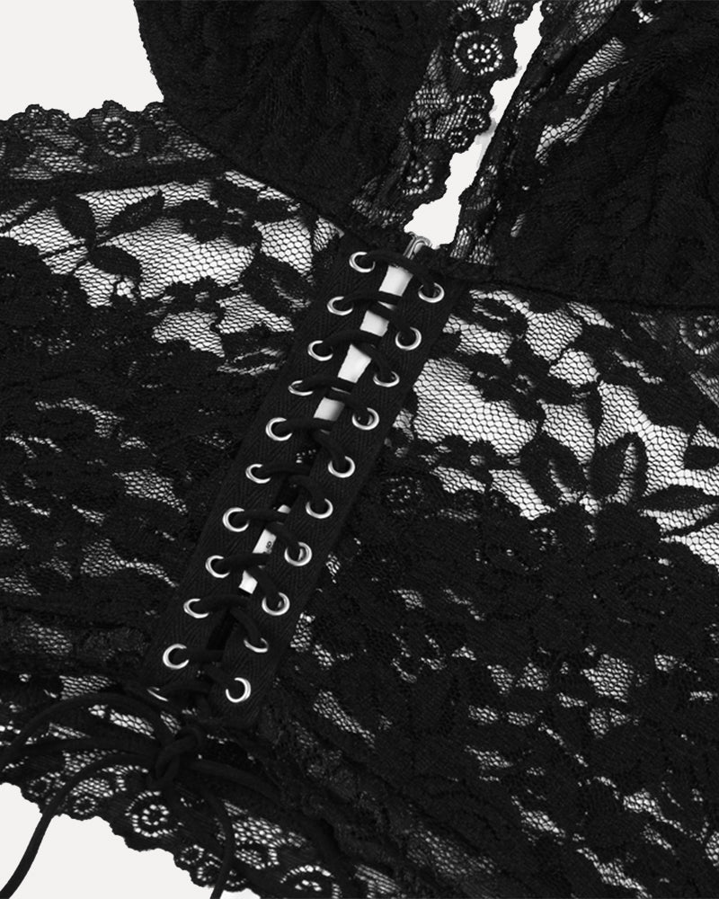 Black corset-style lace bodice with crisscross eyelet lacing and floral mesh