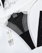 Lace bra with black mesh panels, adjustable straps, and silver hook hardware