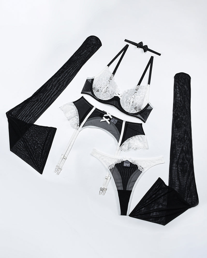 Lace lingerie set including push-up bra, garter belt, and matching underwear and straps
