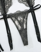 Black lace garter belt with embroidered panel and adjustable suspender straps