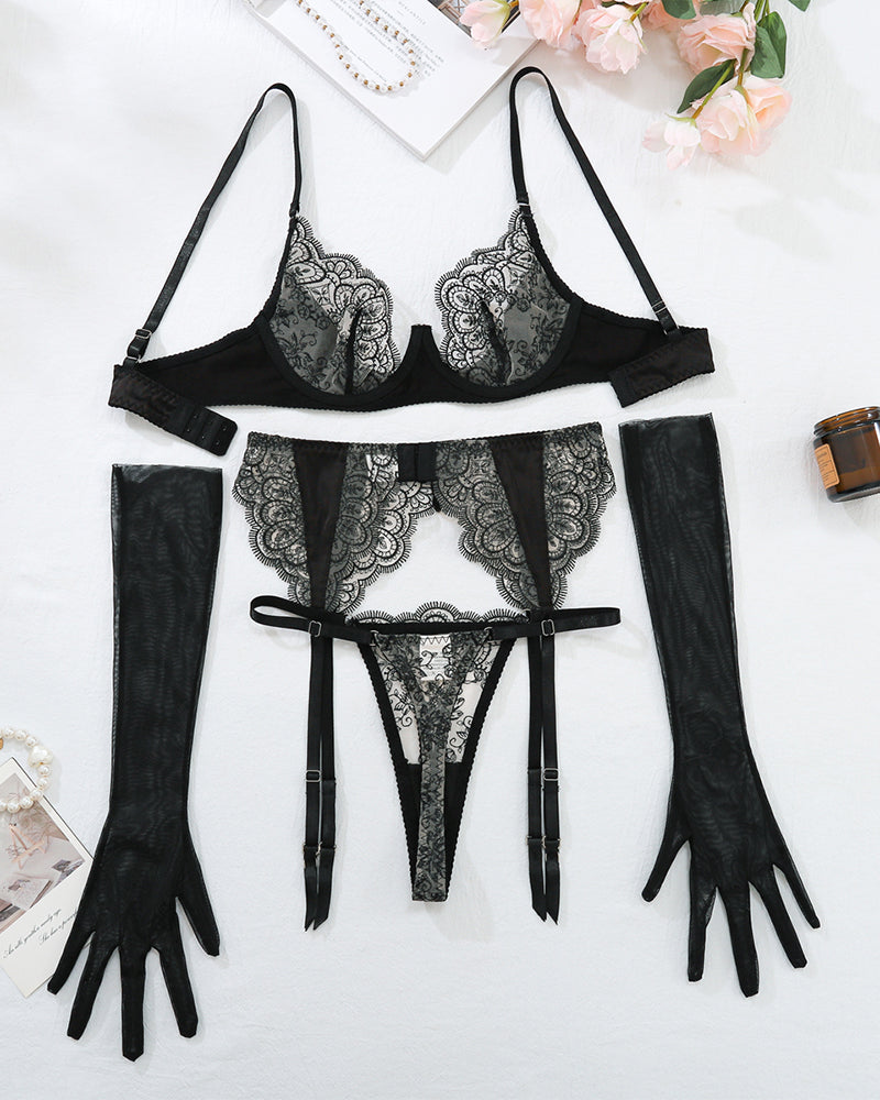 Black lace lingerie set: bra, garter belt, thong, and sheer gloves and thigh-high stockings