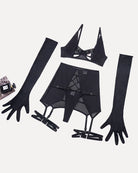 Black lingerie pieces flat lay: bra, mini skirt, garters, and long mesh gloves