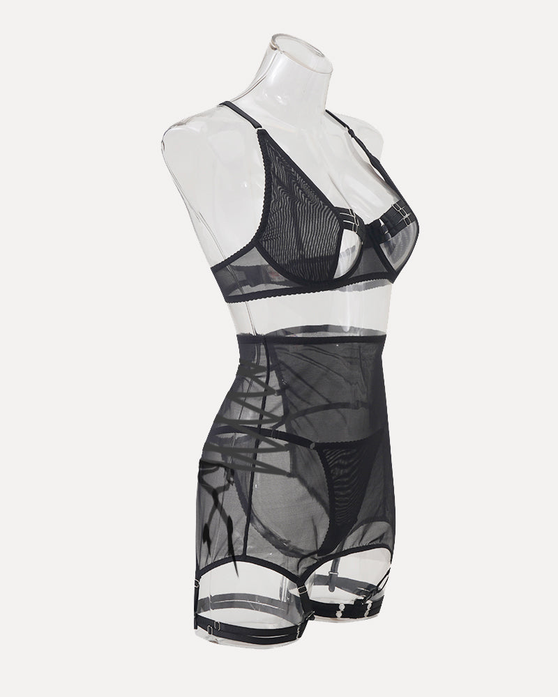 Black mesh lingerie mini dress on mannequin with strappy bra and garter belt