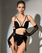 Black mesh lingerie set with bra, garter belt, suspenders, and gloves