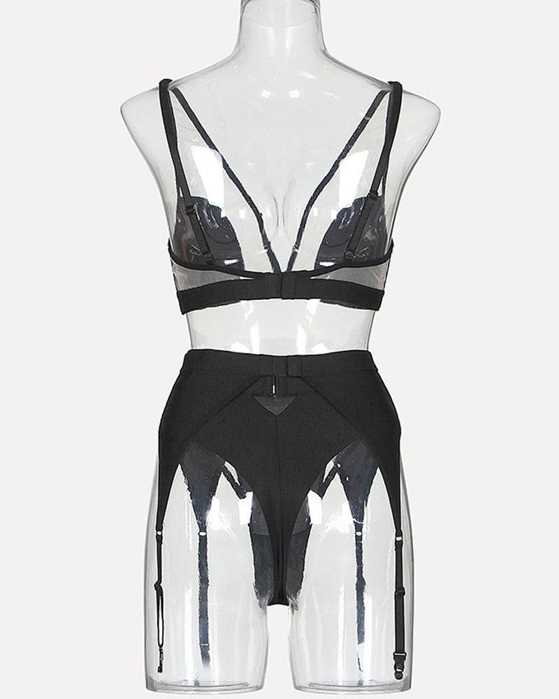 Black mesh lingerie set on mannequin with triangle bra and high-waist garter briefs