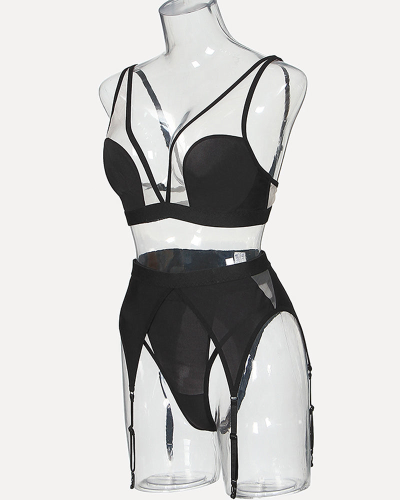 Black mesh lingerie set on mannequin with bra and high-cut garter briefs