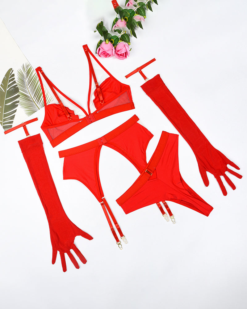 Red lingerie set with strappy bra and garter-style straps plus matching fingerless gloves