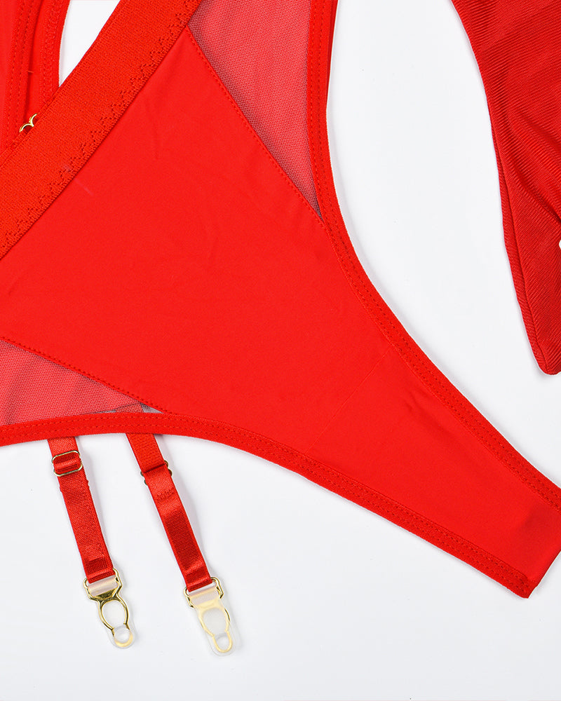 Red garter straps with gold-tone clasps attached to lingerie panel