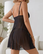 Black mesh lingerie babydoll with lace trim and V-neck, open back straps