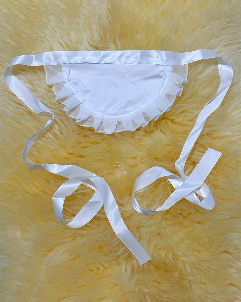 White sheer lace thong-style panties with ruffle trim