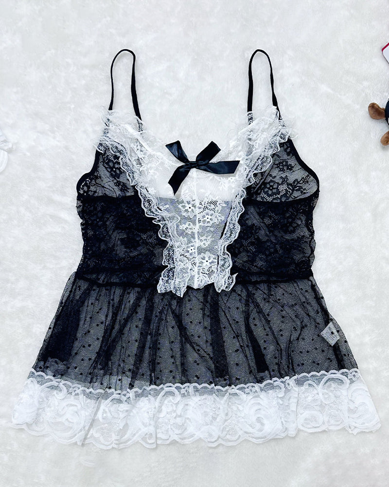 Flat lay of black and white lace maid set, corset-style bodice, center bow, tulle skirt