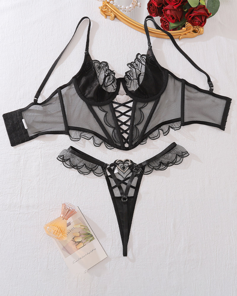 Black lingerie corset set with sheer sleeves, heart lace trim, lace-up front