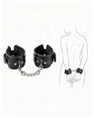 Black leather plush wrist cuffs with chain link connector and snap strap hardware
