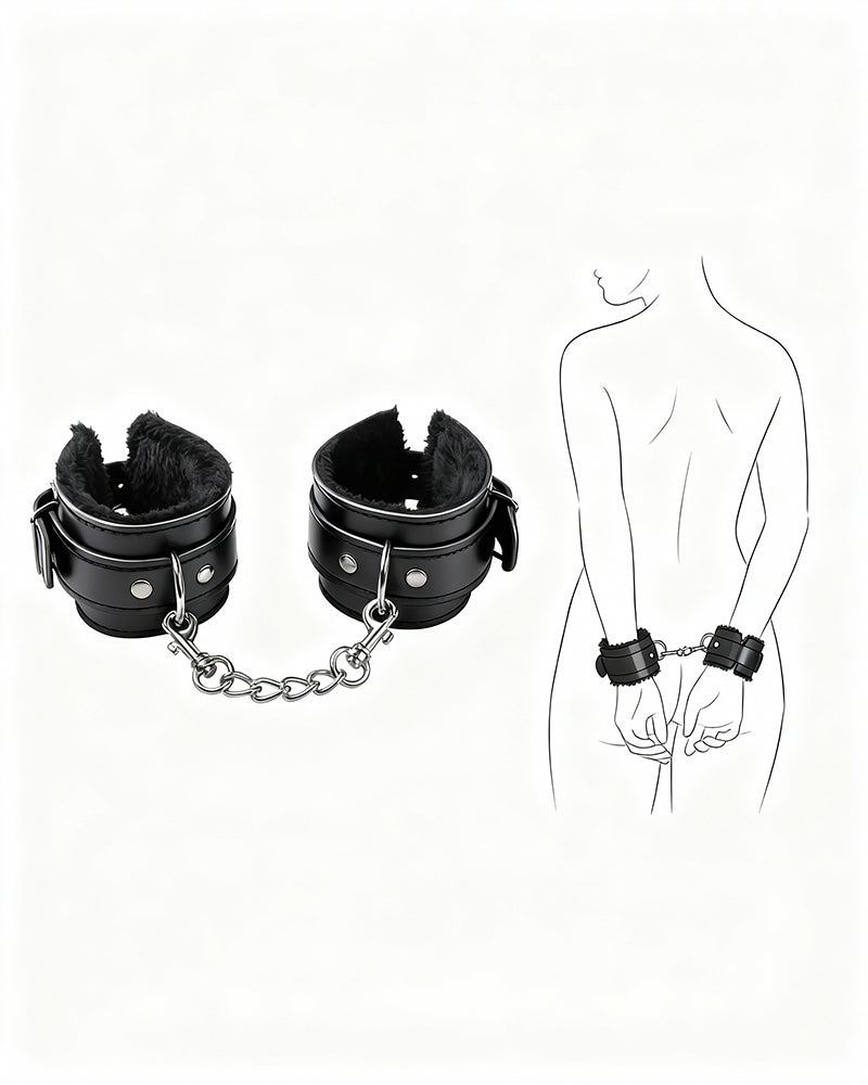 Black leather plush wrist cuffs with chain link connector and snap strap hardware