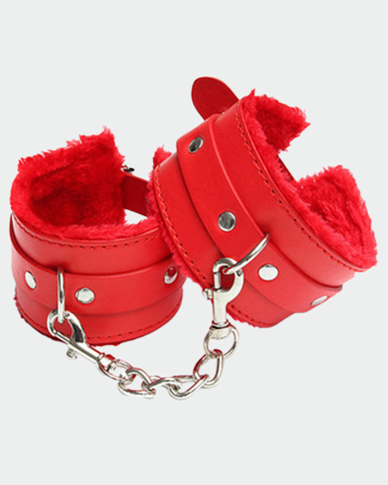 Red leather plush wrist cuffs with silver chain, round studs, and short strap tab