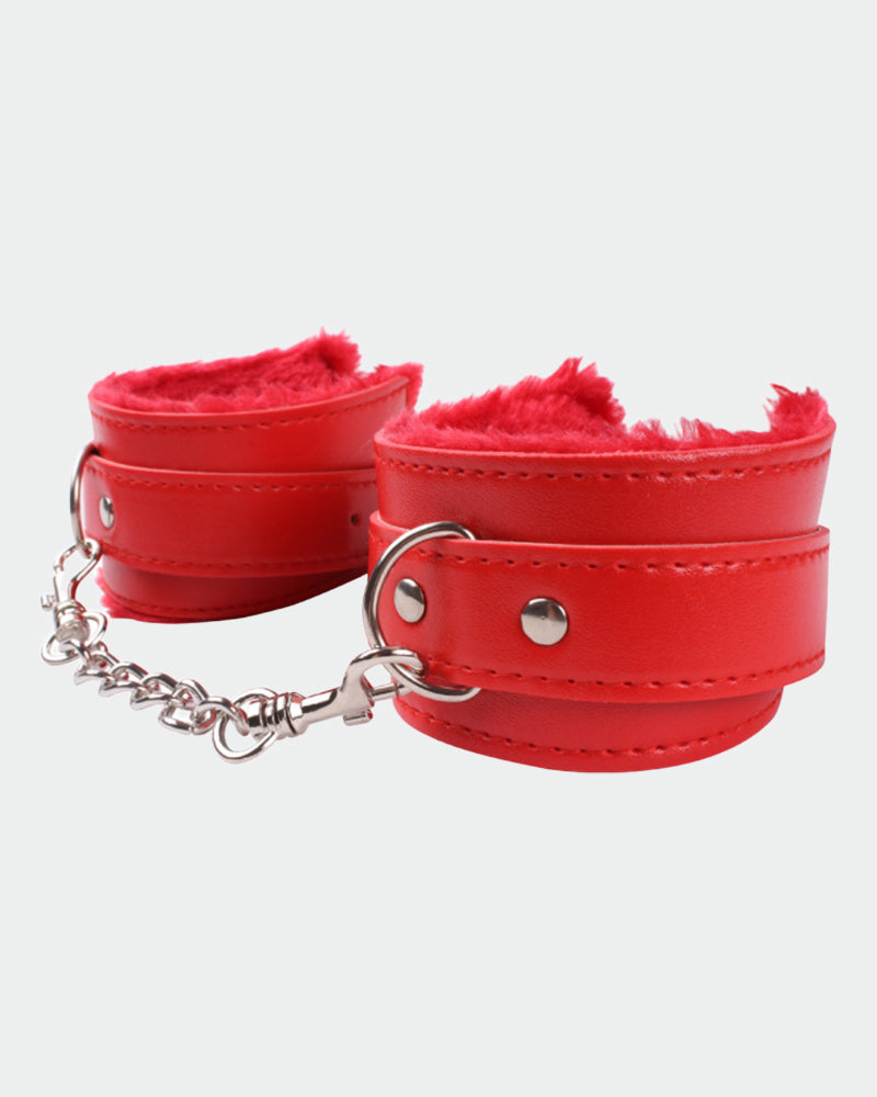 Red leather plush wrist cuffs with silver chain connection and metal hardware at sides