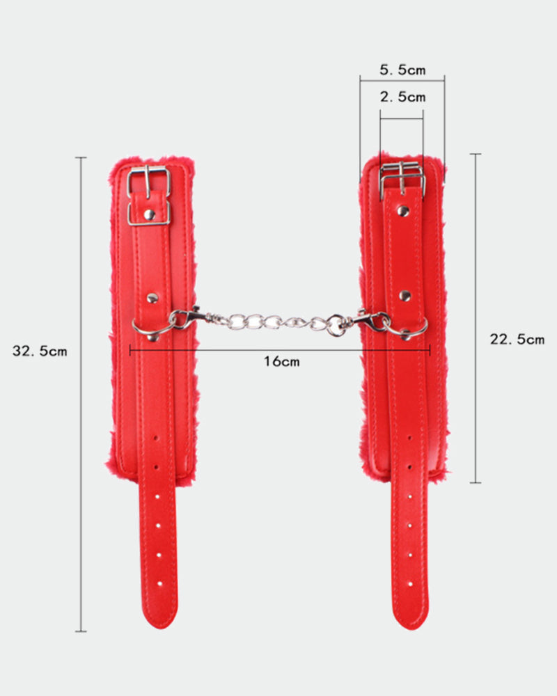 Red plush leather wrist cuffs with buckles, chain link, and studded strap